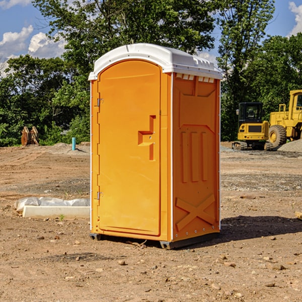 what is the cost difference between standard and deluxe portable toilet rentals in Redig